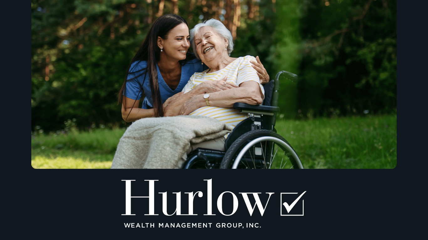 Elderly woman in a wheelchair smiling with a caretaker